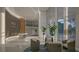 Grand lobby area showcasing modern architecture, high ceilings, ample seating, and a view of lush greenery at 5701 Bowen Daniel Dr. # 806, Tampa, FL 33616