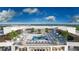 Aerial view of a rooftop pool with lounge chairs and luxury amenities at 5701 Bowen Daniel Dr. # 806, Tampa, FL 33616