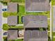Aerial view of neighborhood homes displaying well-maintained yards and manicured landscaping at 5831 Caldera Ridge Dr, Lithia, FL 33547