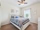 Well lit bedroom with a ceiling fan and a large window for natural light at 5831 Caldera Ridge Dr, Lithia, FL 33547
