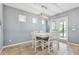 Bright dining area with tile flooring, a modern light fixture, and access to the outdoor space at 5831 Caldera Ridge Dr, Lithia, FL 33547