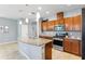 Beautiful kitchen with a granite island, modern appliances, and ample counter space for cooking at 5831 Caldera Ridge Dr, Lithia, FL 33547