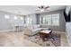 A cozy living room features a comfortable sofa, a colorful rug, and natural light from large windows at 5831 Caldera Ridge Dr, Lithia, FL 33547