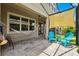 Cozy patio with pavers, a hammock, shade sail, and comfortable seating for relaxing outdoors at 5831 Caldera Ridge Dr, Lithia, FL 33547