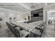 Stunning community bar area with granite counters, comfortable seating, and modern lighting at 6133 Wire Grass Ct, Nokomis, FL 34275