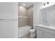 Neutral bathroom featuring a shower and tub, tile accents, and a bright vanity at 6133 Wire Grass Ct, Nokomis, FL 34275