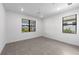 A bedroom illuminated with natural light featuring tile floors and contemporary window trim at 6133 Wire Grass Ct, Nokomis, FL 34275