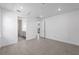 A bedroom featuring an en-suite bathroom, large windows, and tile flooring at 6133 Wire Grass Ct, Nokomis, FL 34275