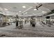 Spacious gym filled with state-of-the-art fitness equipment and ample natural light at 6133 Wire Grass Ct, Nokomis, FL 34275