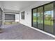A spacious lanai offers outdoor living with brick pavers and large sliding glass doors to the interior at 6133 Wire Grass Ct, Nokomis, FL 34275