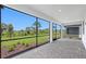 Screened patio area with a view of backyard at 6133 Wire Grass Ct, Nokomis, FL 34275