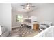 Bright bedroom with a fan, a window letting light in, and a bunk bed set at 615 6Th N Ave, Safety Harbor, FL 34695