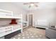 Versatile bedroom featuring bunk beds, a crib, wood floors and cozy décor, ideal for children and restful nights at 615 6Th N Ave, Safety Harbor, FL 34695