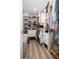 Walk-in closet featuring custom shelving, ample storage and wood floors, providing an organized and functional space at 615 6Th N Ave, Safety Harbor, FL 34695