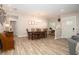 Inviting dining room features an elegant chandelier, light wood floors and access to the entry and living room at 615 6Th N Ave, Safety Harbor, FL 34695