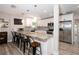 Modern kitchen featuring granite countertops, stainless steel appliances, and bar seating at 615 6Th N Ave, Safety Harbor, FL 34695