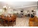 Open-concept design reveals the dining and living room, blending together to create a cozy and inviting space at 615 6Th N Ave, Safety Harbor, FL 34695