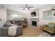 Cozy living room with comfortable seating, a fireplace, and lots of natural light at 615 6Th N Ave, Safety Harbor, FL 34695