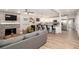 Spacious open-concept living area with a view into the modern kitchen at 615 6Th N Ave, Safety Harbor, FL 34695