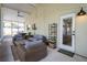 Inviting screened-in patio offers cozy seating and views of the backyard at 615 6Th N Ave, Safety Harbor, FL 34695