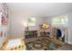 Spacious playroom features fun décor, natural light, wood floors and plenty of room for activities and imagination at 615 6Th N Ave, Safety Harbor, FL 34695