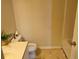 Bathroom with a toilet, sink, and shower featuring neutral walls and floors at 6203 Calamari Pl, Riverview, FL 33578