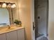 Bathroom featuring a vanity, mirror, and shower stall, ready for refurbishment and modern updates at 6203 Calamari Pl, Riverview, FL 33578