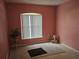 Bedroom featuring neutral walls, carpet, and a window for natural light at 6203 Calamari Pl, Riverview, FL 33578