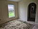 Bedroom featuring a window with natural light and neutral walls, ready for personalization and comfortable living at 6203 Calamari Pl, Riverview, FL 33578