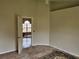 A secondary bedroom featuring neutral walls and an open doorway at 6203 Calamari Pl, Riverview, FL 33578