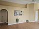 Open-concept living room with modern flooring and neutral-colored walls at 6203 Calamari Pl, Riverview, FL 33578