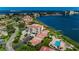 Beautiful aerial view of waterfront condos with lush landscaping and a swimming pool at 6218 Palma Del Mar S Blvd # 503, St Petersburg, FL 33715