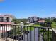 Balcony view of a condo community surrounded by green spaces and blue skies at 6218 Palma Del Mar S Blvd # 503, St Petersburg, FL 33715