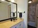 Bathroom featuring a large mirror and neutral color scheme at 6218 Palma Del Mar S Blvd # 503, St Petersburg, FL 33715