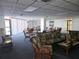 A well lit gathering space with multiple seating areas and bright windows at 6218 Palma Del Mar S Blvd # 503, St Petersburg, FL 33715
