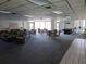 Large carpeted common room with multiple seating areas and a pool table at 6218 Palma Del Mar S Blvd # 503, St Petersburg, FL 33715