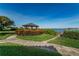 Picturesque gazebo with stunning water views and well-maintained landscaping at 6218 Palma Del Mar S Blvd # 503, St Petersburg, FL 33715