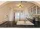 View of the kitchen featuring white cabinets, appliances, and a black countertop at 6218 Palma Del Mar S Blvd # 503, St Petersburg, FL 33715