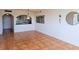 Open living space with decorative mirrors, chandelier, and an archway to the adjacent kitchen at 6218 Palma Del Mar S Blvd # 503, St Petersburg, FL 33715