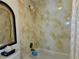 Shower stall with decorative patterned tile, shower head, and handle at 6218 Palma Del Mar S Blvd # 503, St Petersburg, FL 33715
