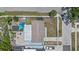 Aerial view of the property showcasing the spacious lot, driveway, and surrounding neighborhood at 6417 Willow Wood Ln, Tampa, FL 33634
