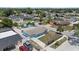 Aerial view of the home showcasing the spacious lot, driveway, and surrounding neighborhood at 6417 Willow Wood Ln, Tampa, FL 33634