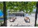 View of the backyard featuring pavers, seating, a basketball court, and an enclosed porch at 6417 Willow Wood Ln, Tampa, FL 33634