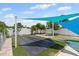 Spacious backyard featuring a partially covered area and ample green space for outdoor activities at 6417 Willow Wood Ln, Tampa, FL 33634