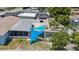 A backyard with partially covered area, basketball hoop, and storage shed at 6417 Willow Wood Ln, Tampa, FL 33634