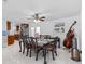 Bright dining room featuring modern table with seating for eight and a view into the kitchen at 6417 Willow Wood Ln, Tampa, FL 33634