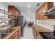 Well-equipped kitchen with granite countertops and stainless steel appliances, flowing into the dining area at 6417 Willow Wood Ln, Tampa, FL 33634