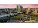Overhead view of a city showcasing modern architecture, a well-manicured park, and waterfront views, blending urban living at 777 N Ashley Dr # 2513, Tampa, FL 33602
