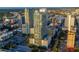 Expansive aerial shot showcasing modern high-rise architecture in a bustling urban setting with city streets and a parking area at 777 N Ashley Dr # 2513, Tampa, FL 33602