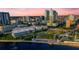 Aerial view of the city skyline with modern buildings, a waterfront park, and a tranquil river creating a serene atmosphere at 777 N Ashley Dr # 2513, Tampa, FL 33602